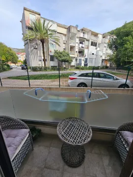 Furnished terrace with seating furniture and a view of the building and surroundings. - image 11