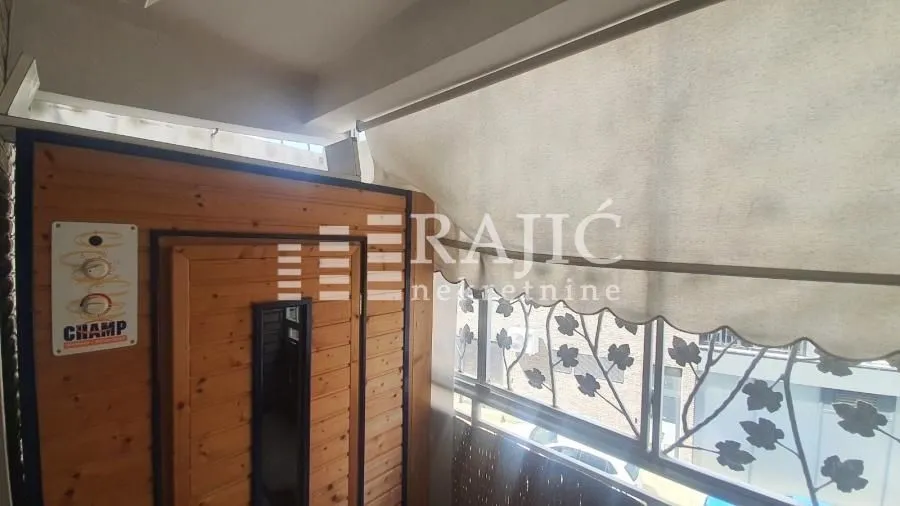 Enclosed terrace with a wooden sauna.