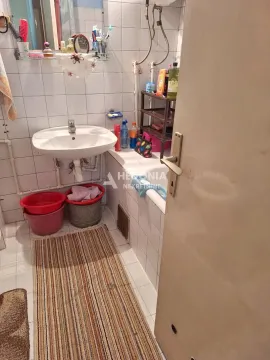 View of the bathroom with a sink and tiling. - image 3