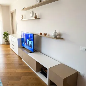 Living room with modern furniture and a TV. - image 7