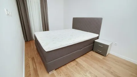 Furnished bedroom with a double bed and a nightstand. - image 8