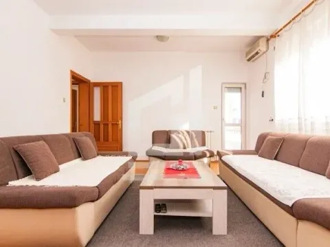 Living room with a sofa set and a coffee table. - image 3