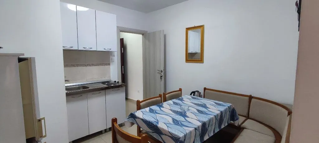 Small kitchen with a dining table and corner bench.
