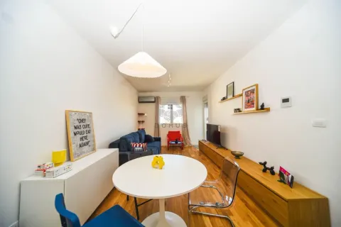 Spacious living room with a dining area and modern furniture. - image 10