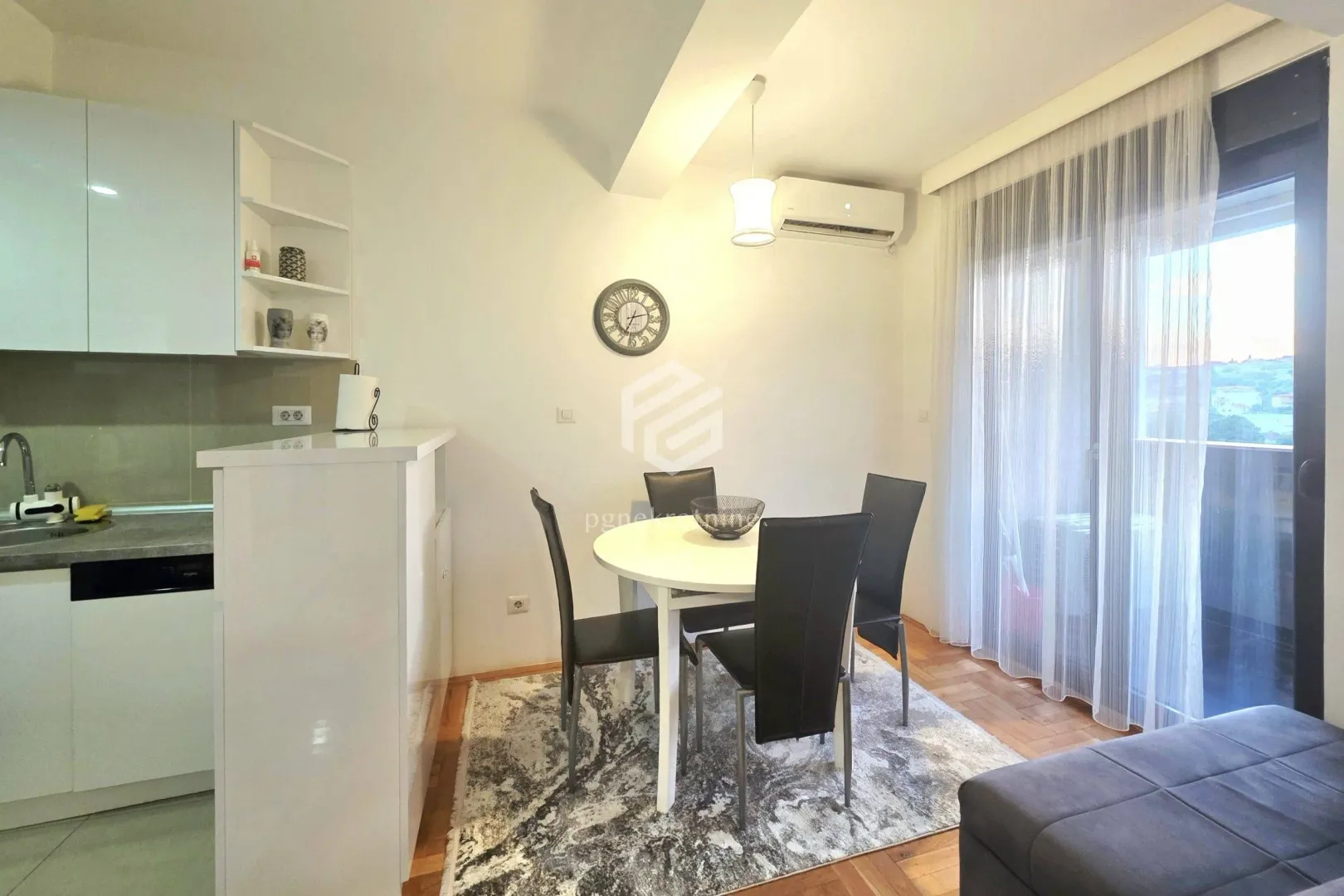 Dining area with a dining table and chairs, connected to the kitchen.