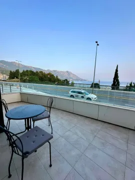 Terrace with seating furniture and a view of the sea and surroundings. - image 7