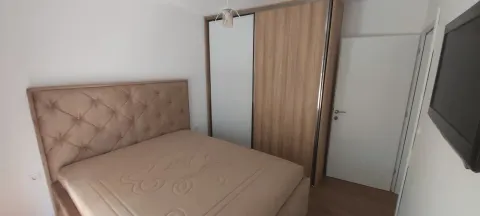 Bright bedroom featuring a double bed and a large built-in wardrobe. - image 4