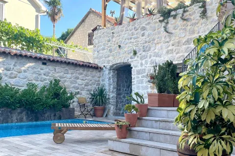 Courtyard with a swimming pool and a stone house. - image 10