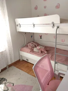 Children's room with a bunk bed and a desk. - image 10