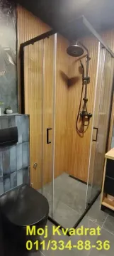 Moderno opremljeno kupatilo sa tuš kabinom i crnim sanitarijama. - image 9