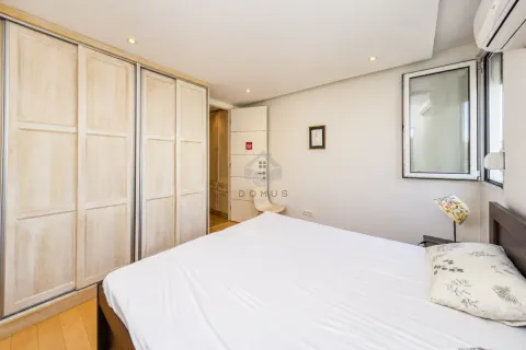 Furnished bedroom with a large wardrobe and a double bed. - image 7