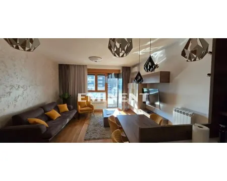 Living room with a sofa, dining table, and access to the terrace. - image 12