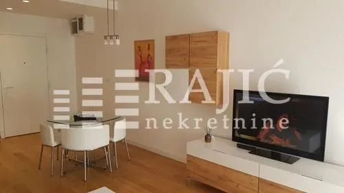 Living room with dining area and furniture.