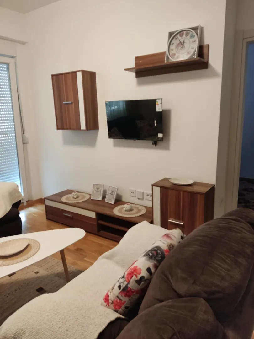 Living room with a TV and seating area.
