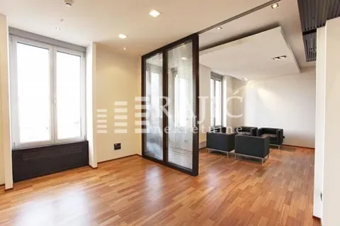 Spacious bright living room with parquet flooring and a glass partition wall. - image 2