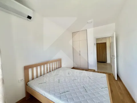Bedroom with a double bed, wardrobe, and air conditioning. - image 6