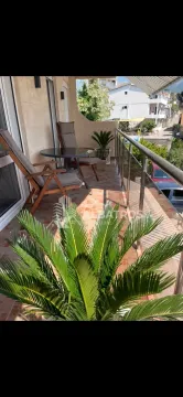 Furnished terrace with seating furniture and a view of the surroundings. - image 12