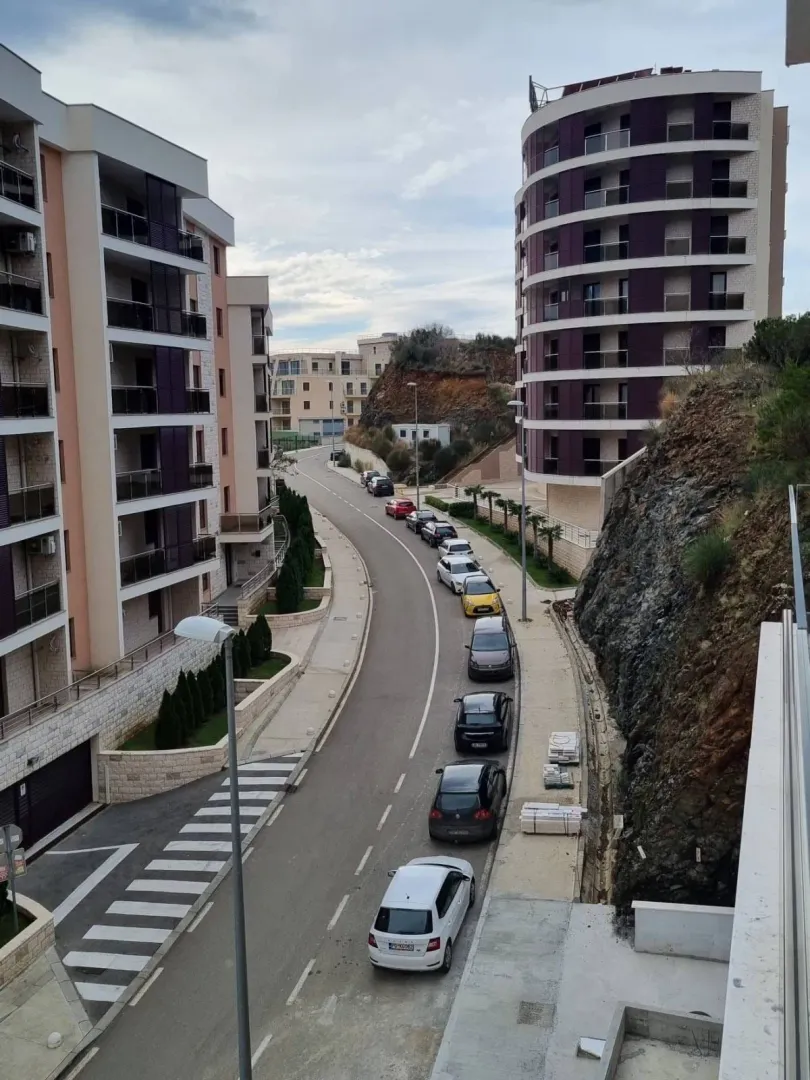 View of the street and residential buildings in front of the property.