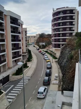 View of the street and residential buildings in front of the property. - image 15