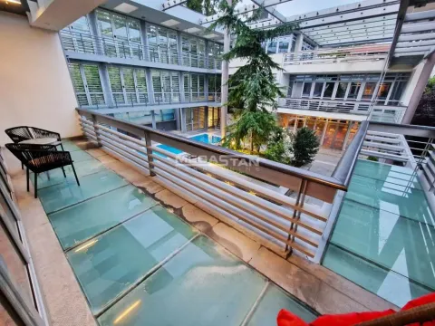 Large terrace with a glass floor overlooking the inner courtyard of the building. - image 12