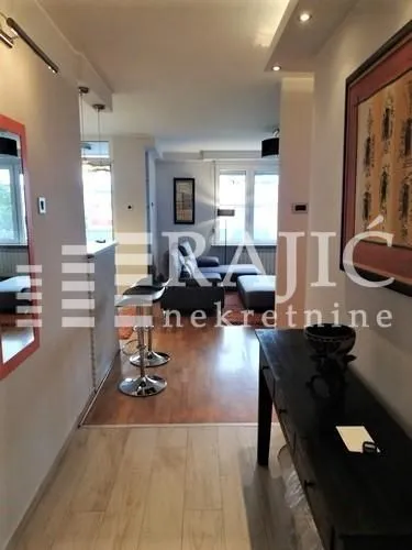 View from the hallway towards the living room and dining area.