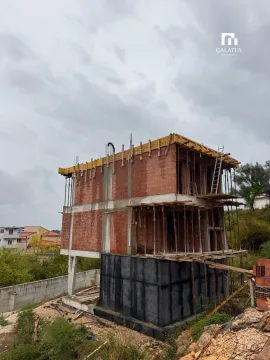 View of a house under construction with concrete structure and bricks. - image 14