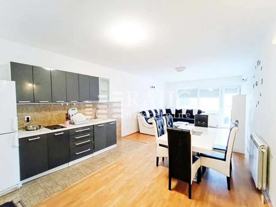 Living room combined with dining area and kitchen.