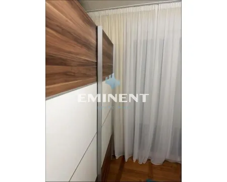 Interior detail featuring a built-in wardrobe and a white curtain. - image 9
