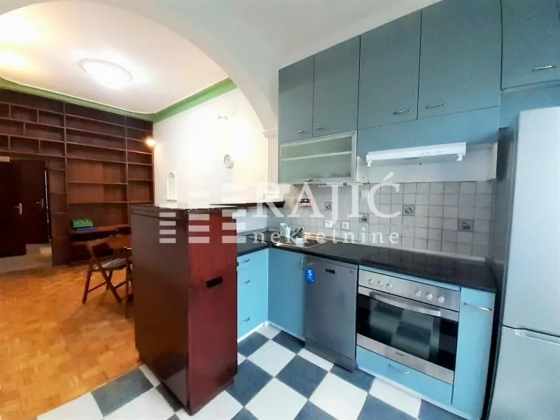 Kitchen connected with the dining area in the apartment.