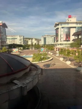 View from the window of the city square and surrounding buildings. - image 3