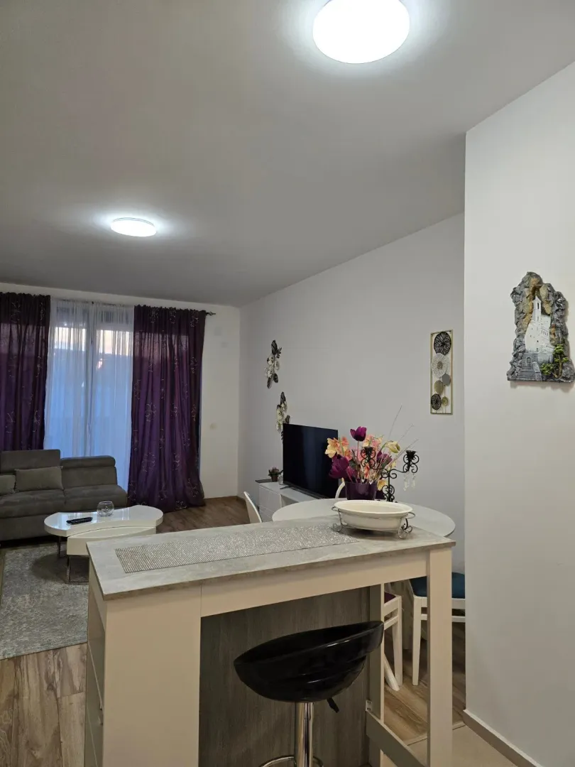 Living room with dining area and sofa set.