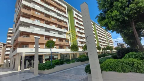 Exterior view of an apartment building with a landscaped yard. - image 8