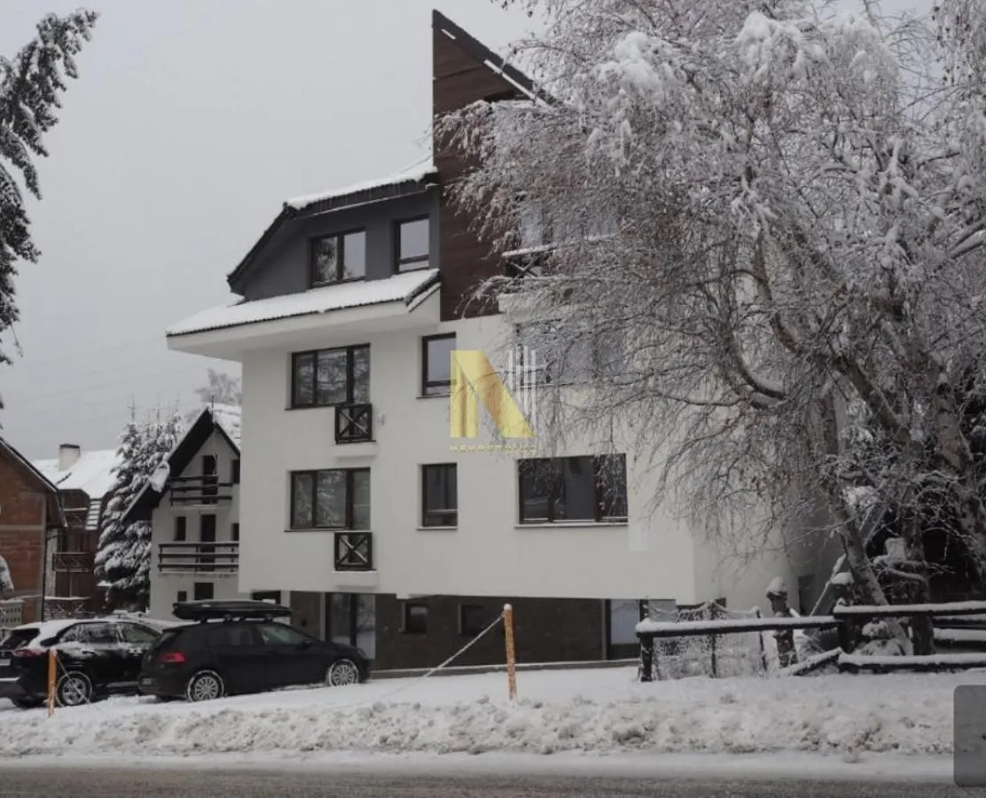 View of the building facade in winter with snow.