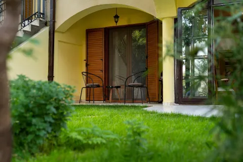 Cozy ground-floor terrace with outdoor seating. - image 5