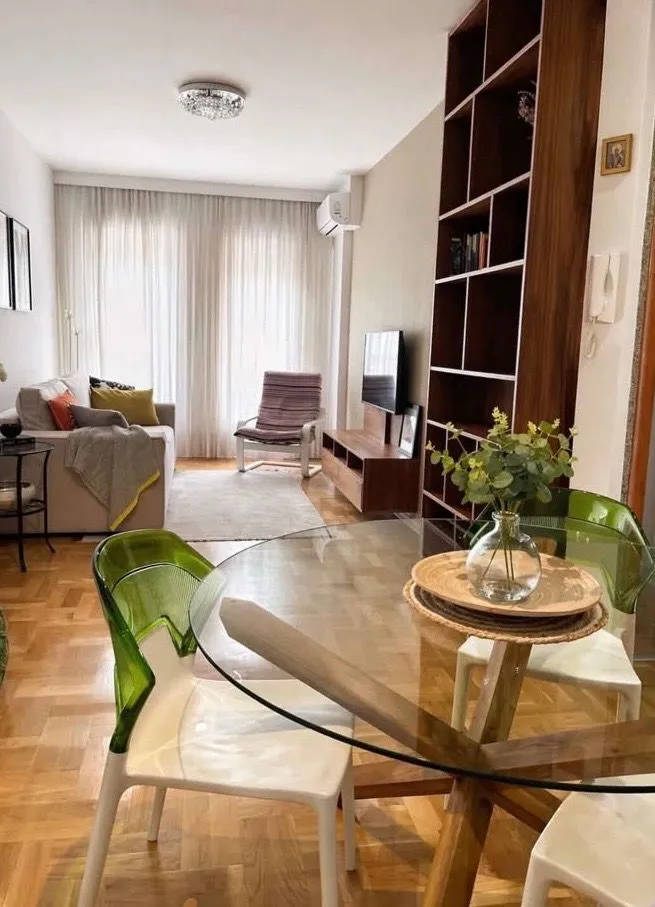 Living room with dining area and sofa.