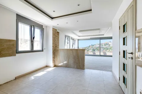 Prazna dnevna soba sa velikim prozorima, kamenim detaljima i izlazom na terasu sa pogledom. - image 16