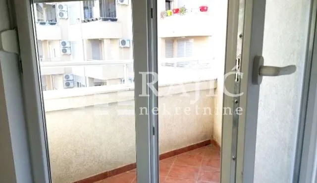 View of the terrace through balcony doors.