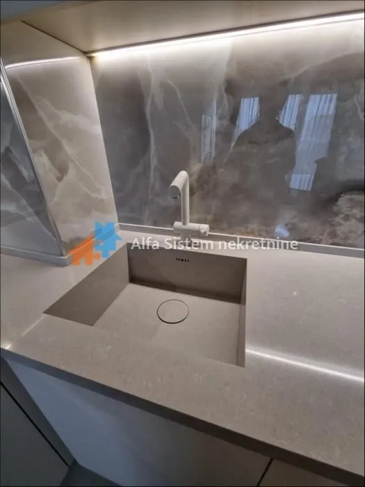 Modern sink with a faucet on the kitchen countertop.