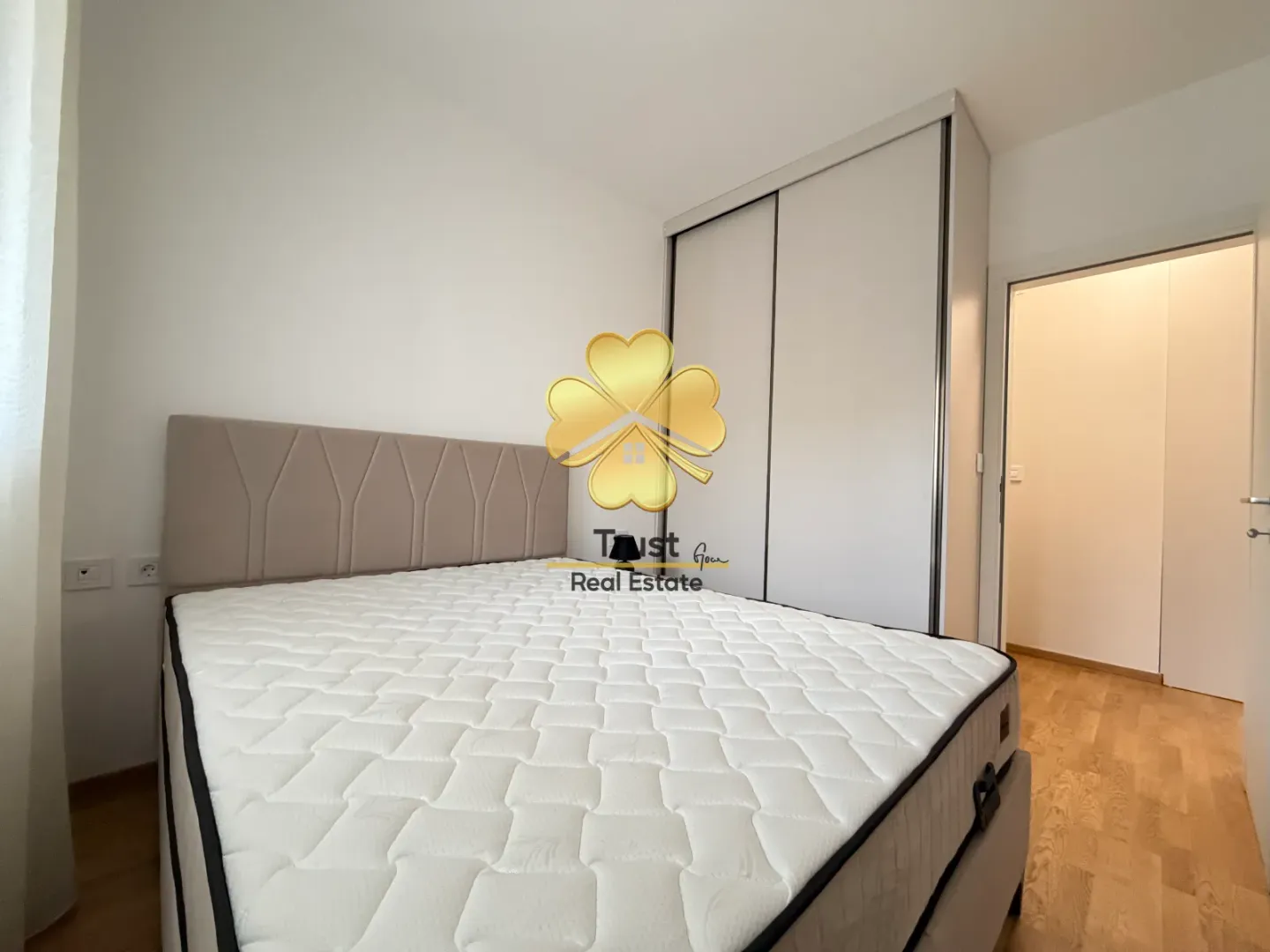 Bedroom with a double bed and built-in wardrobe.