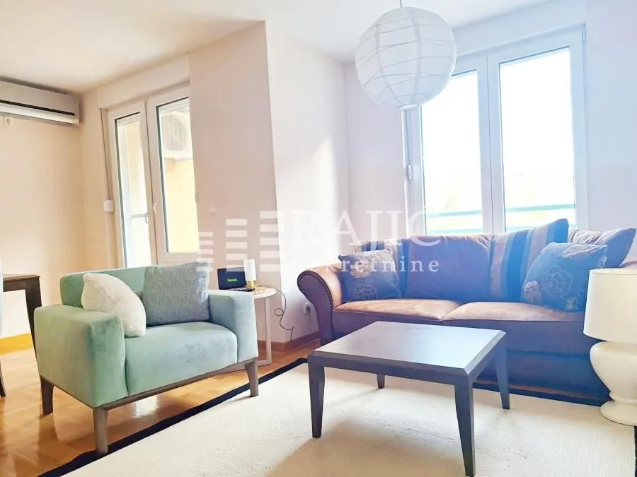 Bright living room with a sofa set and a coffee table.