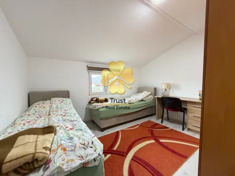 Double bedroom with two beds and a desk. - image 9