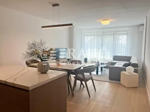 Modern living room with dining area and a kitchen island in the foreground. - image 9