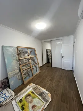 Bright empty room with a built-in wardrobe and wood-style flooring. - image 14