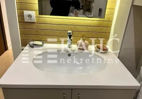 Modern bathroom with sink and mirror. - image 11