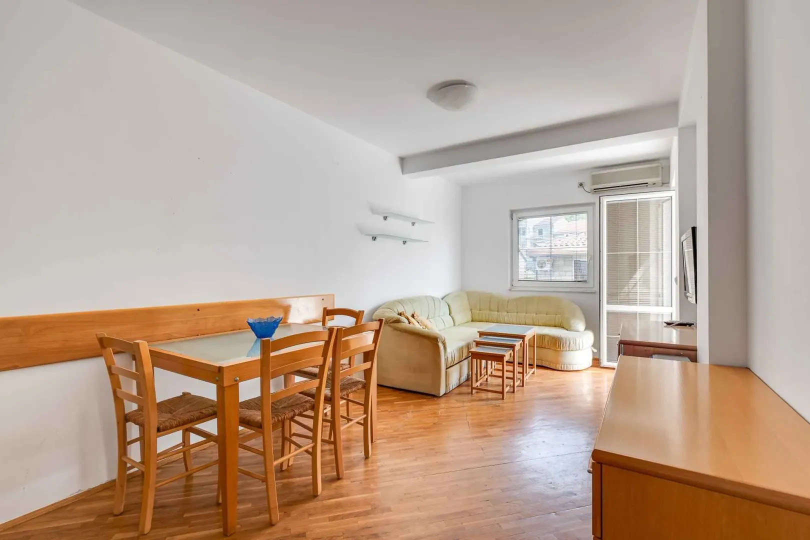 Living room with dining area and seating set.