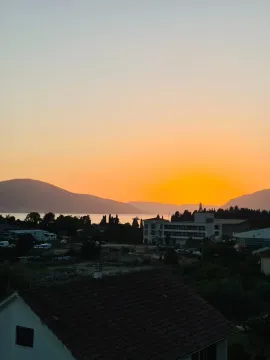 View of the bay and mountains at dusk. - image 8