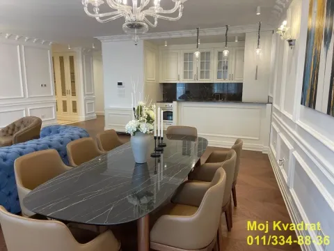 Spacious living room with dining area and kitchen in the background. - image 3