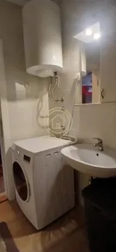 Bathroom with a washbasin, washing machine and water heater. - image 11