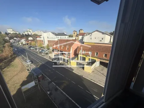 View from the window overlooking the street and surrounding buildings. - image 9