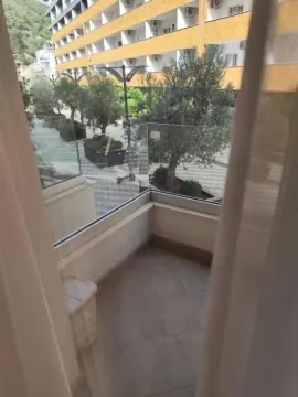 Balcony view overlooking the building courtyard and surrounding greenery. - image 4